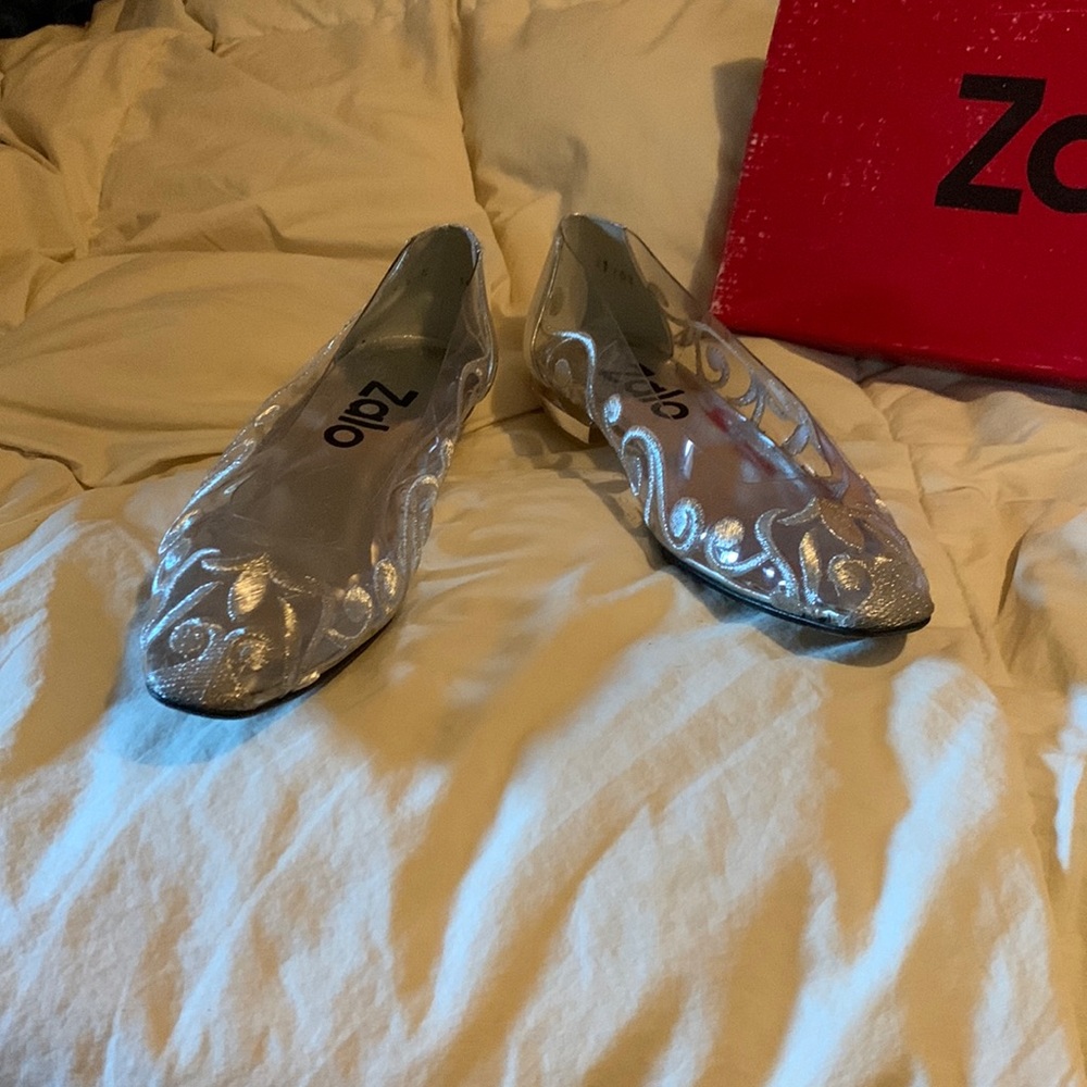 So pretty little delicate shoes in silver and lucite, or the clear stuff